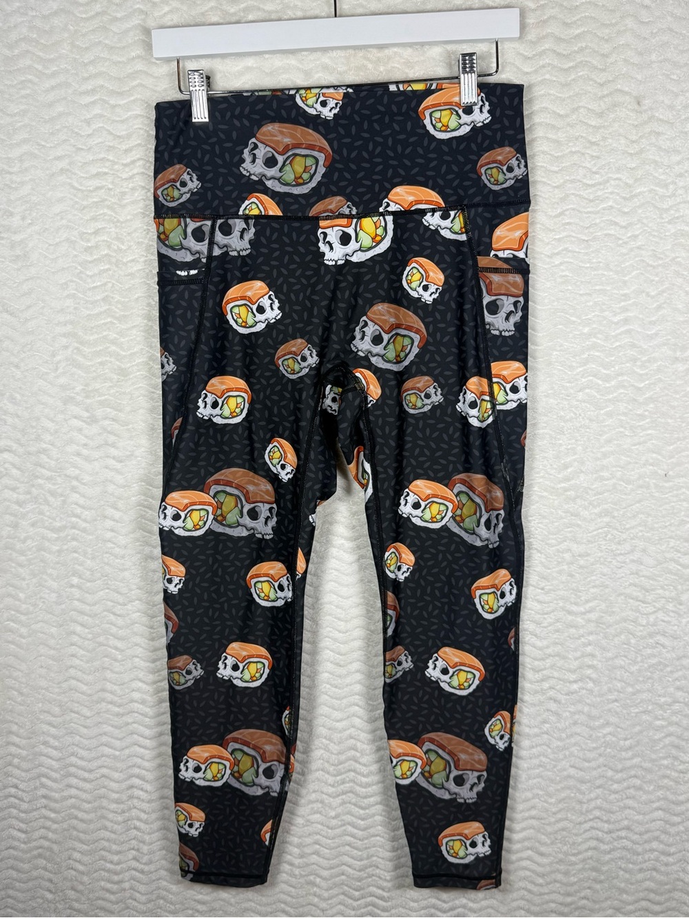 Feed Me Fight Me Black Leggings with Orange, White & Green Skull Sushi Print